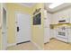Inviting entryway leading to a fully equipped kitchen with modern appliances and ample cabinet space at 1370 Tuscana Ln # 5406, Davenport, FL 33896