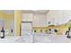 Bright kitchen features white countertops, appliances, cabinets, and a sink at 1370 Tuscana Ln # 5406, Davenport, FL 33896