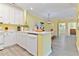 Bright kitchen with island and modern appliances, seamlessly connecting to the dining area at 1370 Tuscana Ln # 5406, Davenport, FL 33896