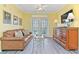 Cozy living room featuring a comfortable leather sofa and elegant furnishings at 1370 Tuscana Ln # 5406, Davenport, FL 33896