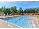 Spacious swimming pool featuring lounge chairs and shaded cabanas for ultimate relaxation at 1370 Tuscana Ln # 5406, Davenport, FL 33896