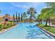 Resort-style pool with a beautiful tropical landscaping, providing a luxurious and relaxing outdoor experience at 1370 Tuscana Ln # 5406, Davenport, FL 33896