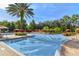 Large community pool is surrounded by lush landscaping and inviting lounge areas at 1370 Tuscana Ln # 5406, Davenport, FL 33896