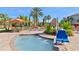 Relax by this inviting pool with a hot tub and comfortable lounge chairs under swaying palm trees at 1370 Tuscana Ln # 5406, Davenport, FL 33896