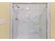 Newly renovated shower features sleek marble tiling and modern fixtures at 1370 Tuscana Ln # 5406, Davenport, FL 33896