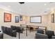 Community theater has a large screen, tiered seating, projector, and movie posters for entertainment at 1370 Tuscana Ln # 5406, Davenport, FL 33896