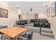 Community theater features tiered seating, movie posters, projector and table for casual movie watching at 1370 Tuscana Ln # 5406, Davenport, FL 33896