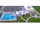 Aerial view of community amenities including a recreational building and swimming pool at 139 Columbia Dr, Poinciana, FL 34759