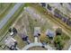 Aerial view of a home showcasing the roof, driveway, and surrounding greenery at 139 Columbia Dr, Poinciana, FL 34759
