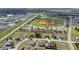 Aerial view of a baseball field with green grass, surrounded by newly built homes at 139 Columbia Dr, Poinciana, FL 34759