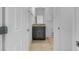 Hallway view of a half bath featuring a granite countertop vanity and tile floors at 139 Columbia Dr, Poinciana, FL 34759