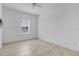 Clean bedroom showcasing tile flooring and a window that provides natural light at 139 Columbia Dr, Poinciana, FL 34759