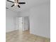Bright bedroom with tile flooring and a neutral color scheme showcases a comfortable living space at 139 Columbia Dr, Poinciana, FL 34759