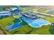 A beautiful community pool and recreational area with basketball courts on a sunny day at 139 Columbia Dr, Poinciana, FL 34759