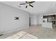 Open-concept living room boasts tile floors, and seamless connection to the adjacent modern kitchen at 139 Columbia Dr, Poinciana, FL 34759