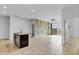 Bright open floor plan features tile floors and a colorful accent wall, perfect for modern living at 139 Columbia Dr, Poinciana, FL 34759