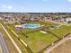 Aerial shot of community pool and common area with houses surrounding at 1431 Lassen St, Haines City, FL 33844