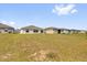 Expansive backyard with lush green grass and views of neighboring homes at 1431 Lassen St, Haines City, FL 33844