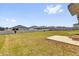 Spacious backyard with a large grassy area and a white vinyl fence at 1431 Lassen St, Haines City, FL 33844