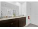 Bathroom featuring double sinks, a vanity, and a mirror at 1431 Lassen St, Haines City, FL 33844