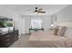 Relaxing bedroom features a ceiling fan, soft carpet, with a light and airy atmosphere at 1431 Lassen St, Haines City, FL 33844