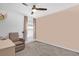 Serene bedroom featuring a comfy chair and soft color tones at 1431 Lassen St, Haines City, FL 33844