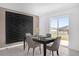 Elegant dining area featuring a decorative wall, contemporary table and sliding doors with backyard views at 1431 Lassen St, Haines City, FL 33844