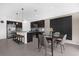 Open concept dining area and kitchen featuring a decorative wall, table with four chairs and island seating at 1431 Lassen St, Haines City, FL 33844