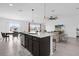 Spacious kitchen island and dining area with great natural light, seamlessly connected to the living room at 1431 Lassen St, Haines City, FL 33844