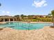 Large community swimming pool with ample seating and nearby covered area at 1431 Lassen St, Haines City, FL 33844