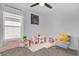 Charming ' room with soft carpeting, a playful table, and a collection of toys for creative play at 1431 Lassen St, Haines City, FL 33844