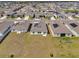 Aerial shot featuring houses with solar panels and spacious yards within a residential neighborhood at 1431 Lassen St, Haines City, FL 33844