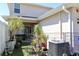Backyard with potted plants, patio, and the home's exterior at 1615 Reflection Cv, St Cloud, FL 34771