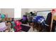 Cozy bedroom space with comfortable seating and a variety of decorative items at 1615 Reflection Cv, St Cloud, FL 34771