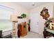 Welcoming entryway featuring stylish decor, a lamp, and tasteful wall art at 1615 Reflection Cv, St Cloud, FL 34771
