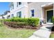 Charming front exterior view highlighting the manicured bushes and well-kept lawn at 1615 Reflection Cv, St Cloud, FL 34771