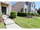 Inviting townhome with a well-manicured lawn and shrubbery enhancing curb appeal at 1615 Reflection Cv, St Cloud, FL 34771
