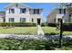 Charming townhome with lush landscaping and a well-manicured lawn welcomes you home at 1615 Reflection Cv, St Cloud, FL 34771