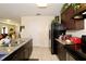 Updated kitchen with a granite countertop and stainless-steel sink and modern appliances and tile flooring at 1615 Reflection Cv, St Cloud, FL 34771