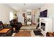 Cozy living room showcasing comfortable seating, fireplace, and neutral decor at 1615 Reflection Cv, St Cloud, FL 34771