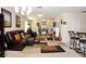 Open-concept living room with stylish furniture, fireplace, and ample natural light at 1615 Reflection Cv, St Cloud, FL 34771