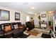 Spacious living area featuring comfortable furniture, neutral tones, and a charming fireplace at 1615 Reflection Cv, St Cloud, FL 34771