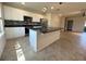 Modern kitchen featuring white cabinets, granite countertops, an island, and stainless steel appliances at 16180 Arbor Crest Aly, Winter Garden, FL 34787