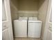 Convenient laundry closet featuring a washer, dryer, and shelving for storage at 16180 Arbor Crest Aly, Winter Garden, FL 34787