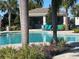 Inviting community pool with comfortable lounge chairs and shaded cabana for relaxation at 16180 Arbor Crest Aly, Winter Garden, FL 34787