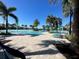 Large community pool with resort-style amenities, seating, and lush landscaping at 16180 Arbor Crest Aly, Winter Garden, FL 34787
