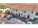 Two-story townhomes feature red-tiled roofs, defined parking spaces, and neatly maintained landscaping at 1631 Little Falls Cir # 92, Orlando, FL 32807