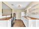 Updated kitchen featuring butcher block counters, white cabinetry, and stainless steel appliances at 1631 Little Falls Cir # 92, Orlando, FL 32807