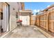 Enclosed outdoor patio with a privacy fence, concrete flooring, and a grill for outdoor cooking at 1631 Little Falls Cir # 92, Orlando, FL 32807