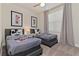 Themed bedroom with two twin beds, decorative bedding, and whimsical wall art at 17220 Blessing Dr, Clermont, FL 34714